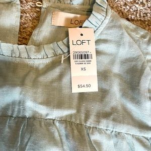 Short sleeve ruffled loft blouse